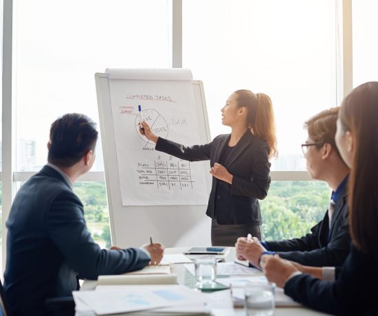 attractive-businesswoman-holding-meeting-scaled.jpg